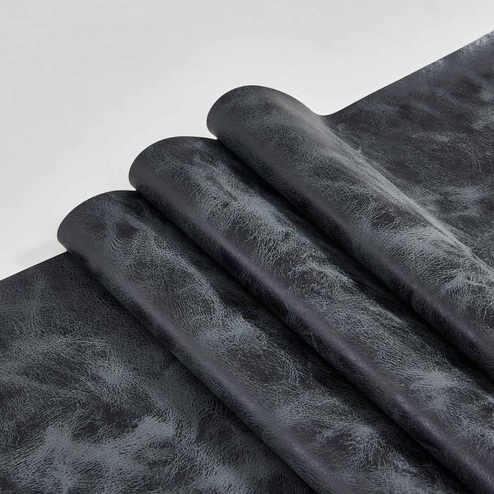 Vinatge black textured fabric on a white background
