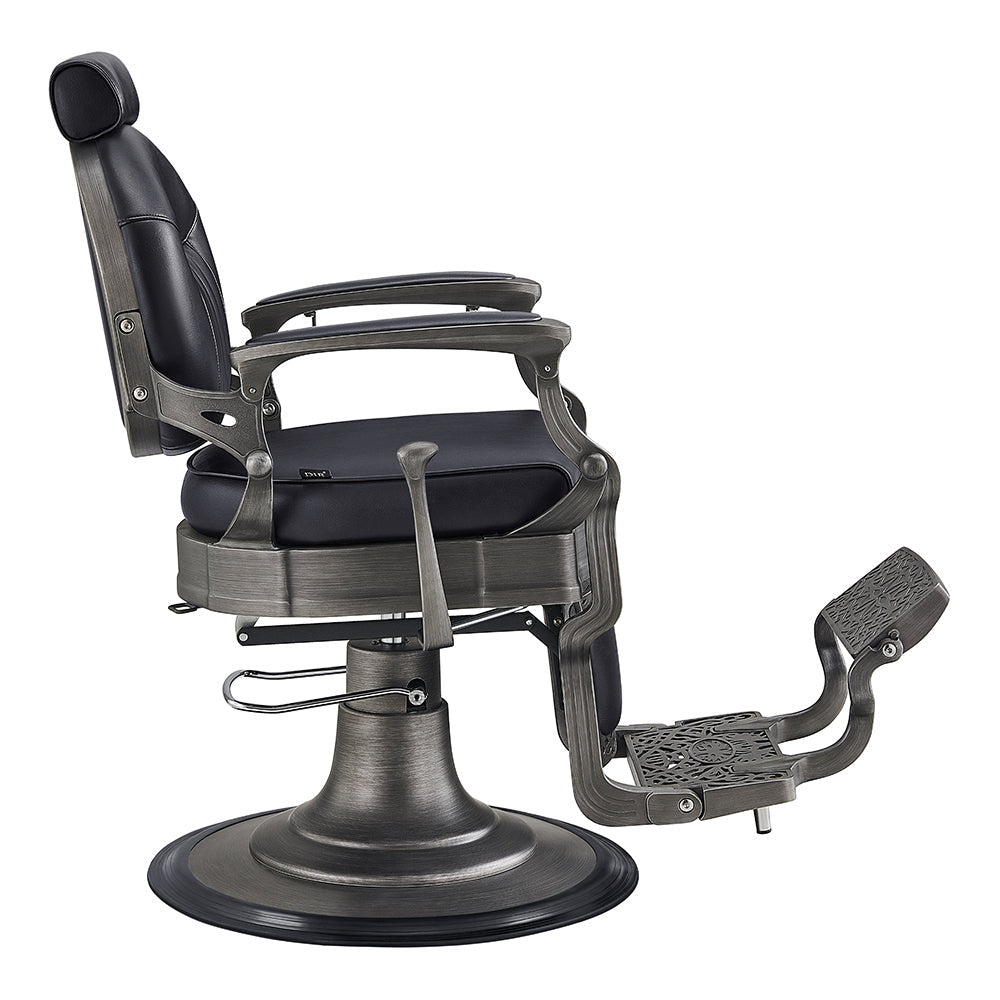 Classic flip-style footrest and padded armrests on Kaiser vintage style barber chair