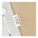Esthetician chair bed close-up of a beige fabric with a 'DIR' label on 