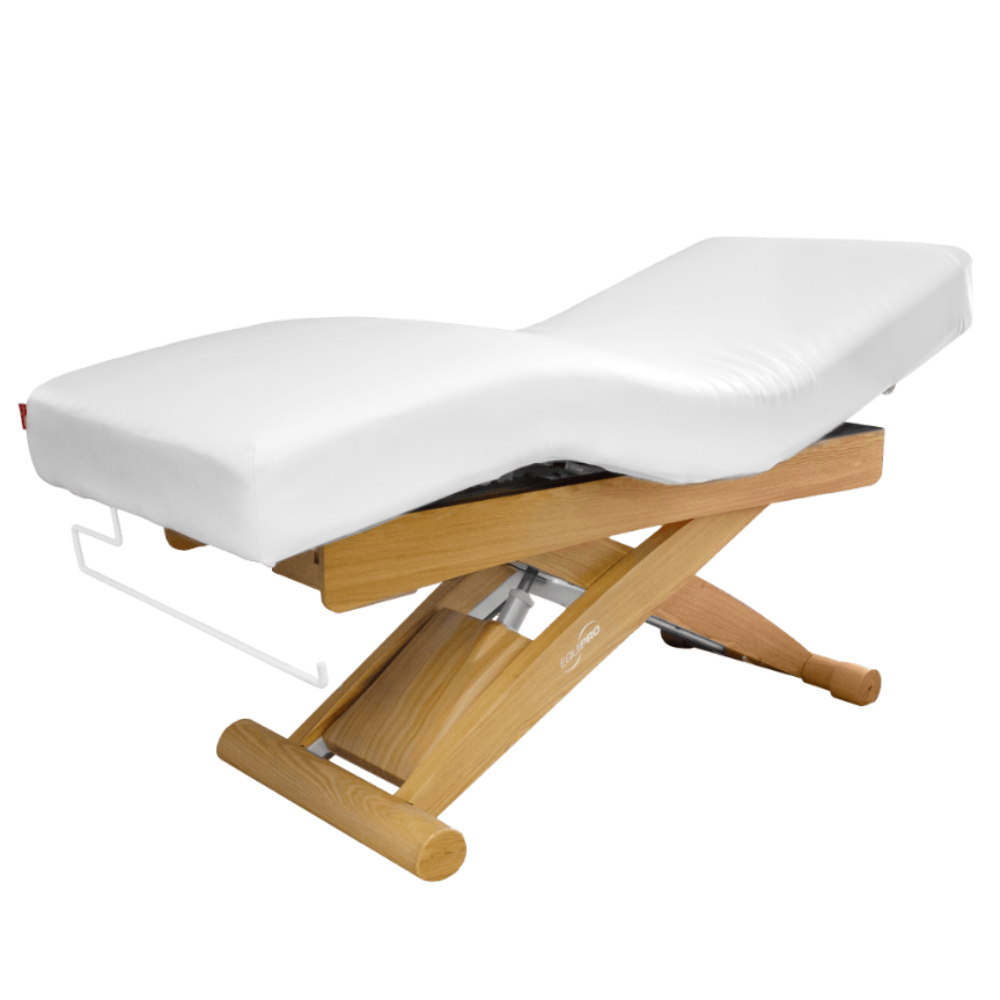 Massage table with white cushion and wooden frame on a black background