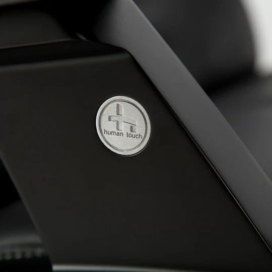 Close-up of Zero Gravity Recliner with 'Human Touch' logo 
