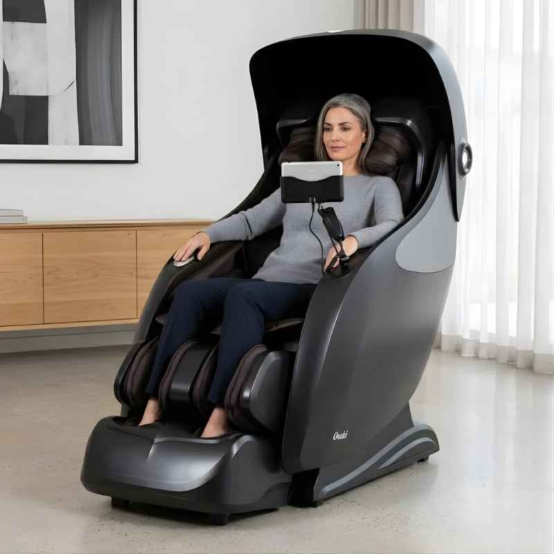 Osaki OP-Ai Xrest 4D - Electric Chair Massager - Woman relaxing in indoor setting