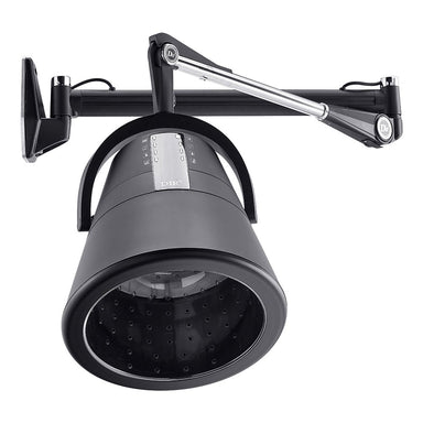 Professional stylist using DIR Orion wall mount hair dryer hood on client in salon