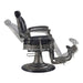 Vintage barber chair DIR Kaiser reclined at 45-degree angle for shaving services